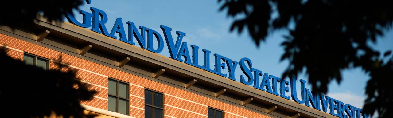 Grand Valley State University sign on building on Pew Campus
